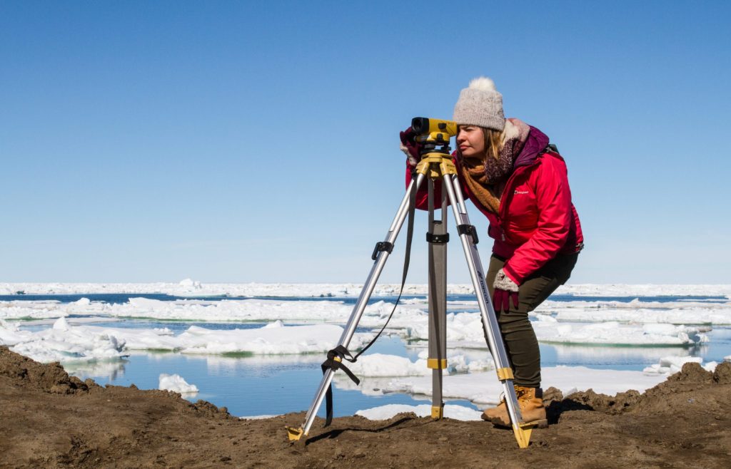 Graduate student Anuszka Mosurska assists with taking measurements for the shoreline community monitoring effort in Utqiaġvik. Credit: Dave Partee | Alaska Sea Grant.