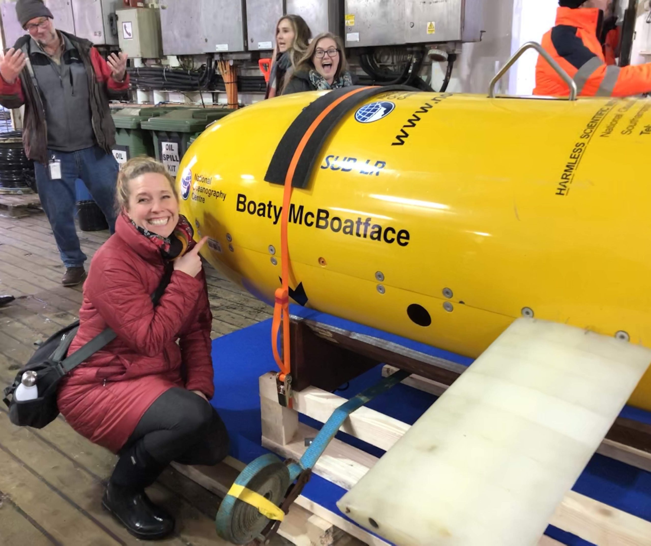 Jessica and a colleague pose next to Boaty McBoatface