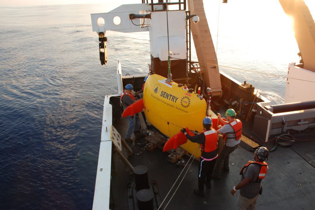 AUV Sentry is secured into its cradle after recovery for the last time during the DEEP SEARCH 2017 expedition. Credit: NOAA OER