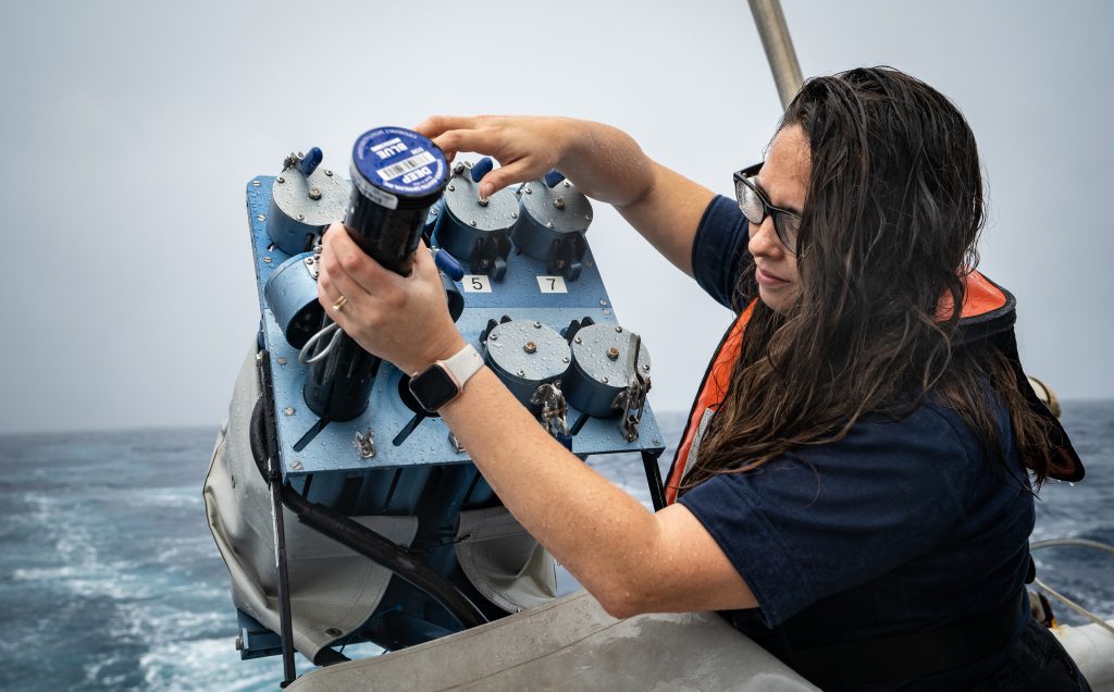 Shannon replenishes the expendable bathythermographs (XBTs) in the XBT auto-launcher. The XBTs collect temperature data about the water column and
