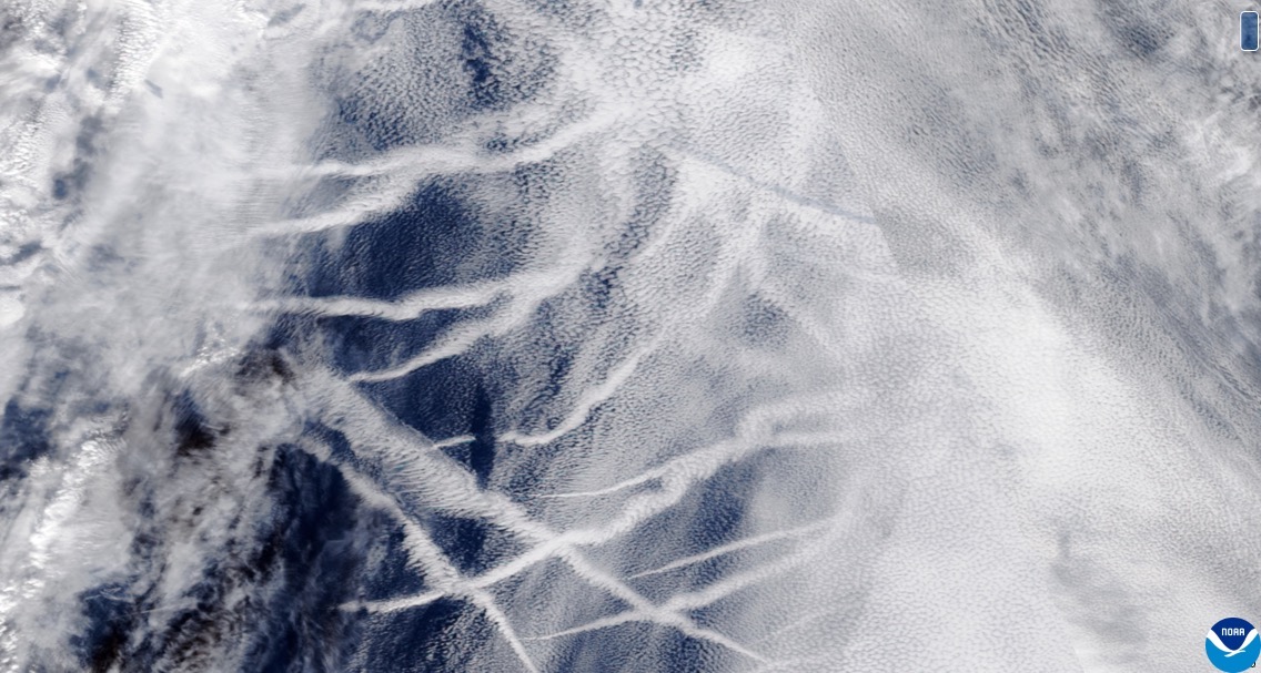 Satellite image showing marine stratus clouds and linear "ship-track" exhaust plumes.